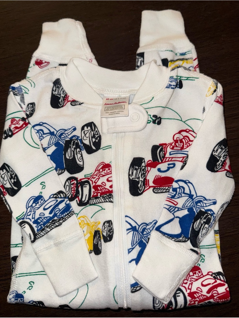 Hanna Andersson White Footie Pajama with Red, Blue & Yellow Race Cars